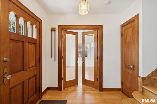 1928 Elm St, Davenport, IA 52803 - entryway featuring light wood finished floors, french doors, and stairs
