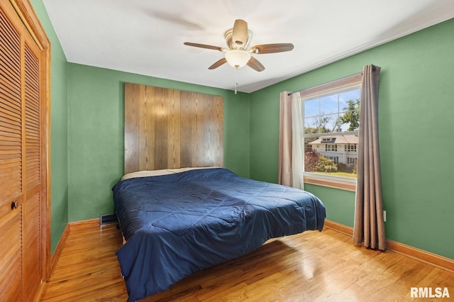 1928 Elm St, Davenport, IA 52803 - bedroom with wood finished floors, a closet, and ceiling fan