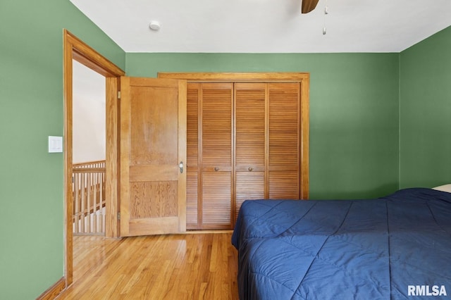 1928 Elm St, Davenport, IA 52803 - bedroom with wood finished floors, a closet, and a ceiling fan