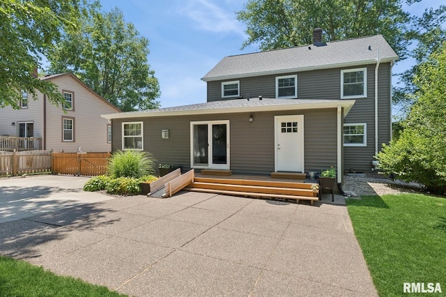 1928 Elm St, Davenport, IA 52803 - back of house featuring a patio area and a chimney