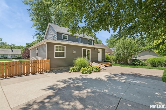 1928 Elm St, Davenport, IA 52803 - traditional-style home with a patio area and a shingled roof