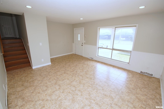 3618 18th St, Bettendorf, IA 52722 - unfurnished room with a wainscoted wall, stairway, and recessed lighting