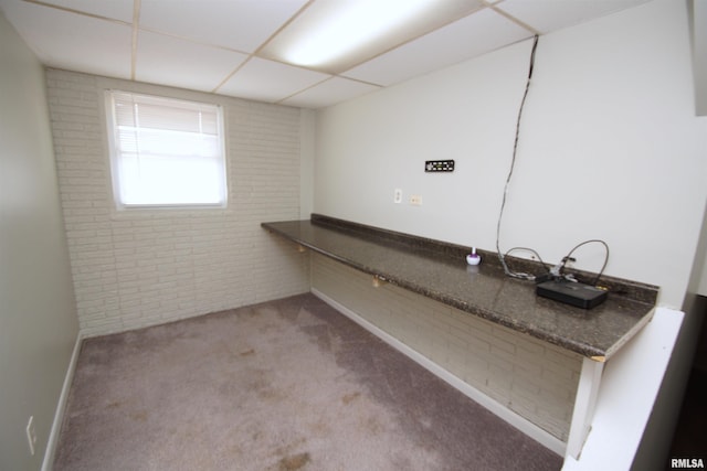 3618 18th St, Bettendorf, IA 52722 - laundry room with brick wall and carpet