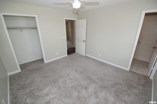 3618 18th St, Bettendorf, IA 52722 - unfurnished bedroom featuring carpet, a closet, and ceiling fan