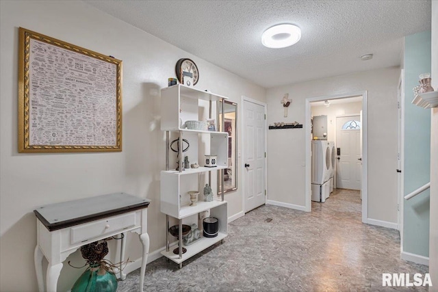 1215 Calvin St, Davenport, IA 52804 - hallway with a textured ceiling and washing machine and clothes dryer