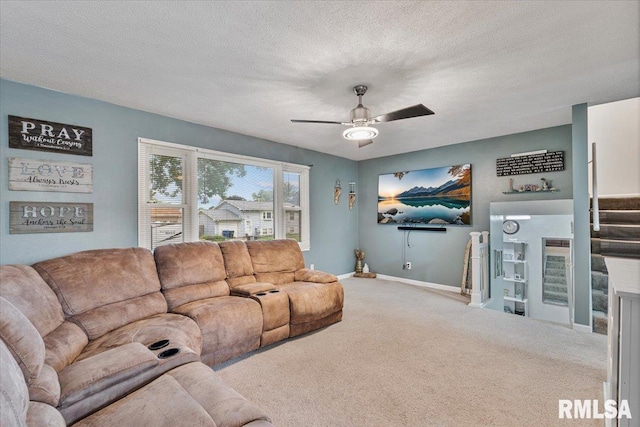 1215 Calvin St, Davenport, IA 52804 - carpeted living room featuring ceiling fan and a textured ceiling