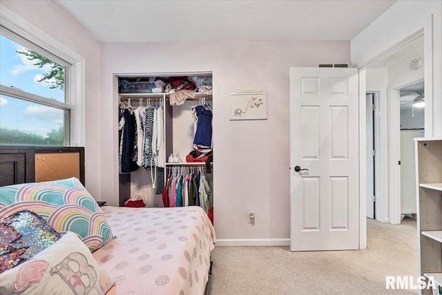 1215 Calvin St, Davenport, IA 52804 - bedroom with light carpet and a closet