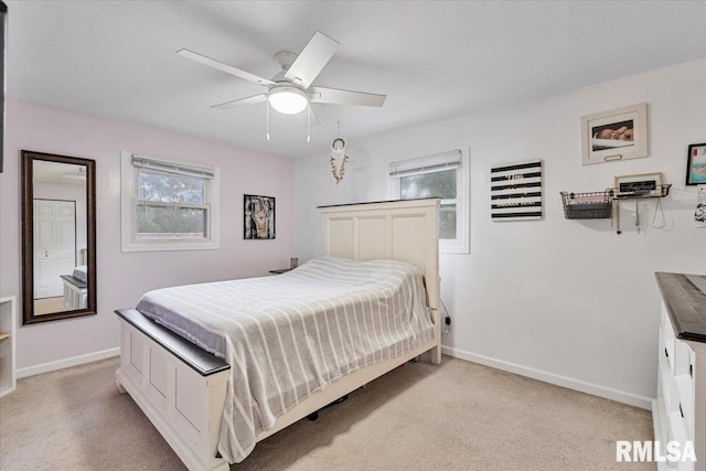 1215 Calvin St, Davenport, IA 52804 - bedroom featuring light colored carpet and ceiling fan
