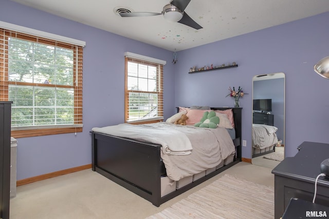 1199 Scenic Place, Le Claire, IA 52753 - bedroom with a ceiling fan and light colored carpet