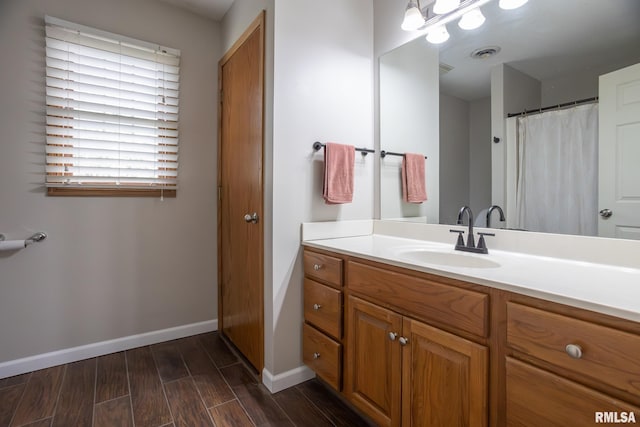 1199 Scenic Place, Le Claire, IA 52753 - bathroom featuring vanity and wood finished floors