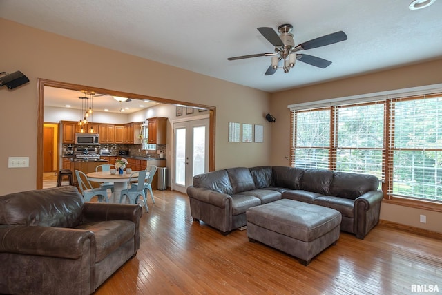 1199 Scenic Place, Le Claire, IA 52753 - living room featuring light wood finished floors and ceiling fan