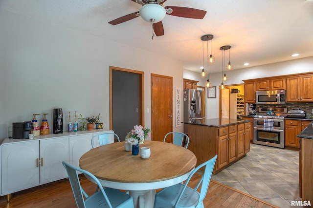 1199 Scenic Place, Le Claire, IA 52753 - dining area with ceiling fan, recessed lighting, and light wood-style floors