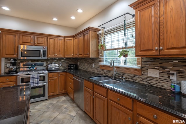 1199 Scenic Place, Le Claire, IA 52753 - kitchen featuring appliances with stainless steel finishes, brown cabinetry, and recessed lighting