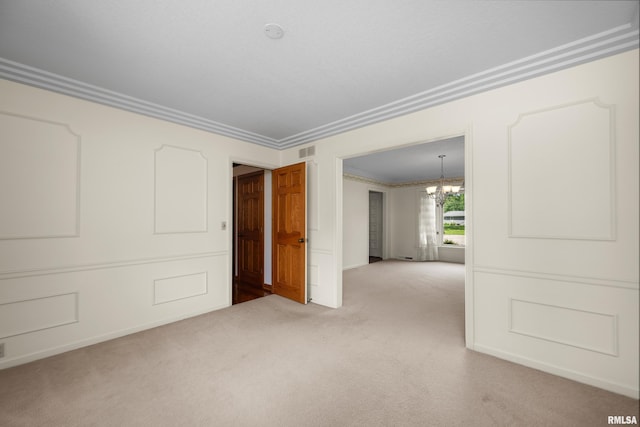 2303 Wynnewood Ct, Davenport, IA 52807 - spare room featuring carpet flooring, crown molding, and a chandelier