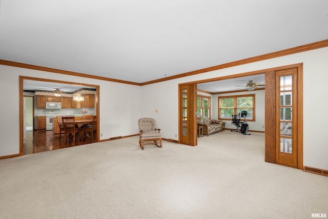 2303 Wynnewood Ct, Davenport, IA 52807 - unfurnished room featuring a ceiling fan, crown molding, and light carpet