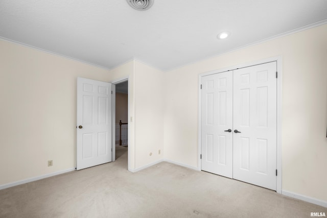 2303 Wynnewood Ct, Davenport, IA 52807 - unfurnished bedroom featuring crown molding, light colored carpet, a closet, and recessed lighting