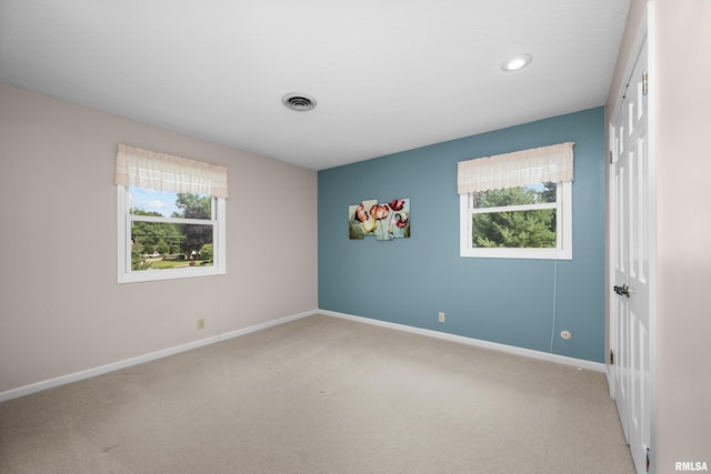 2303 Wynnewood Ct, Davenport, IA 52807 - empty room featuring light carpet and baseboards