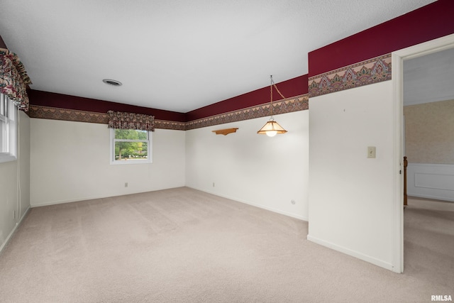 2303 Wynnewood Ct, Davenport, IA 52807 - carpeted spare room with vaulted ceiling and baseboards