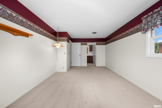 2303 Wynnewood Ct, Davenport, IA 52807 - empty room with baseboards and light colored carpet
