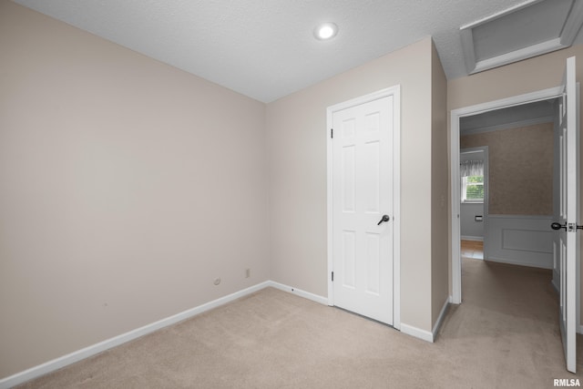 2303 Wynnewood Ct, Davenport, IA 52807 - unfurnished bedroom with light carpet, attic access, and recessed lighting