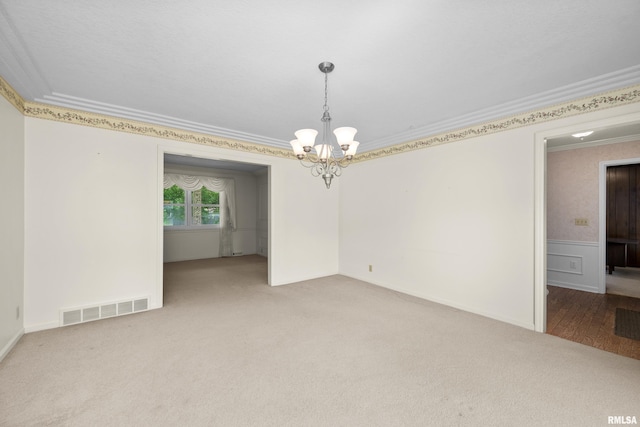 2303 Wynnewood Ct, Davenport, IA 52807 - unfurnished room featuring crown molding, a chandelier, and carpet floors