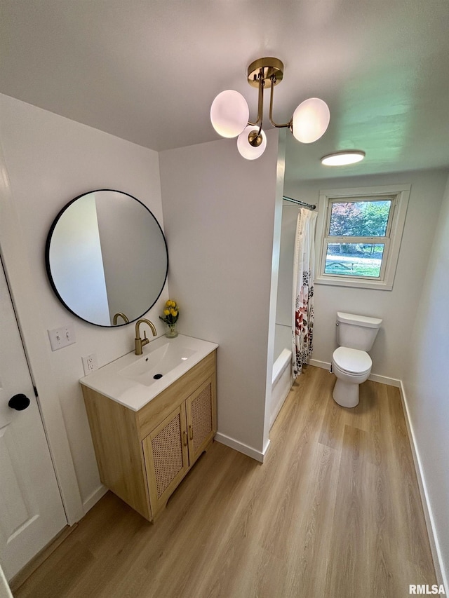 527 S Rotan St, Salem, IL 62881 - full bathroom with wood finished floors, vanity, and shower / tub combo