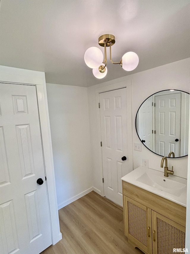527 S Rotan St, Salem, IL 62881 - bathroom featuring wood finished floors and vanity