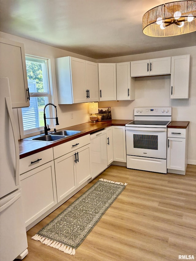 527 S Rotan St, Salem, IL 62881 - kitchen with white appliances, white cabinets, and light wood-type flooring