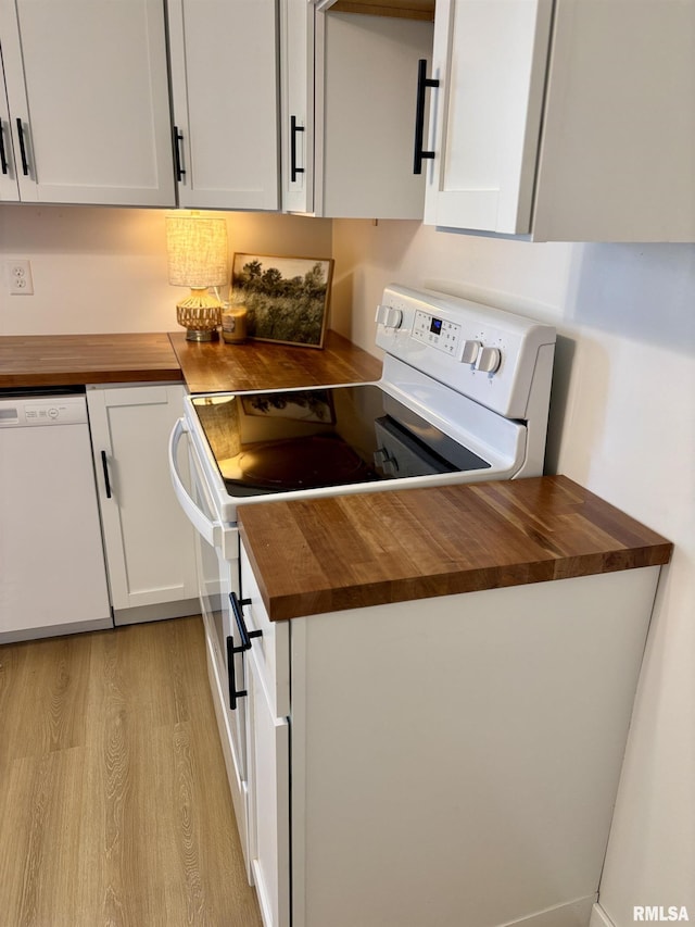 527 S Rotan St, Salem, IL 62881 - kitchen featuring butcher block countertops, white appliances, light wood finished floors, and white cabinetry