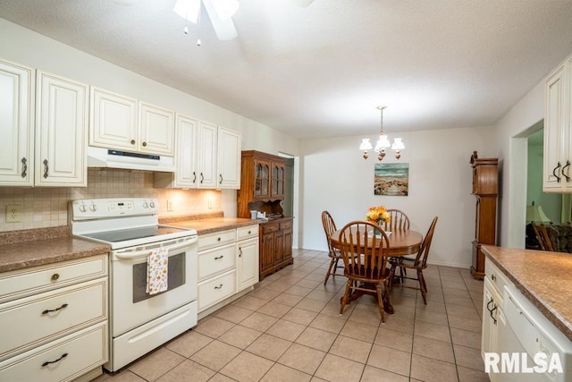 206 Patricia Ln, West Frankfort, IL 62896 - kitchen featuring white appliances, under cabinet range hood, decorative backsplash, a chandelier, and light tile patterned floors