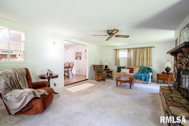 206 Patricia Ln, West Frankfort, IL 62896 - living room with carpet floors, ceiling fan, and a fireplace
