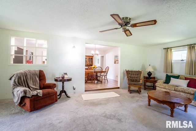 206 Patricia Ln, West Frankfort, IL 62896 - living room with a chandelier, carpet floors, a textured ceiling, and ceiling fan