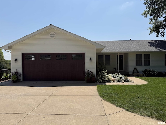 124 Riverview Heights Dr, Le Claire, IA 52753 - ranch-style house featuring a front lawn, roof with shingles, driveway, and a garage