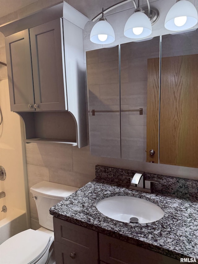 124 Riverview Heights Dr, Le Claire, IA 52753 - bathroom featuring vanity, tile walls, tasteful backsplash, and shower / bathtub combination