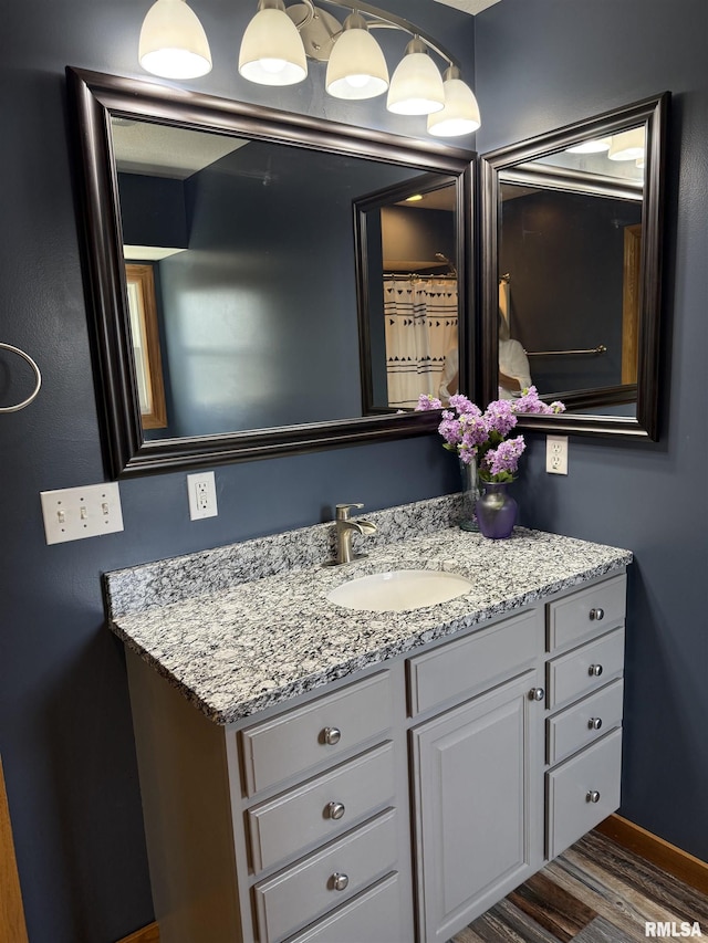 124 Riverview Heights Dr, Le Claire, IA 52753 - bathroom with wood finished floors and vanity