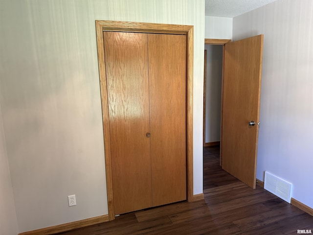 124 Riverview Heights Dr, Le Claire, IA 52753 - unfurnished bedroom featuring a closet and wood finished floors