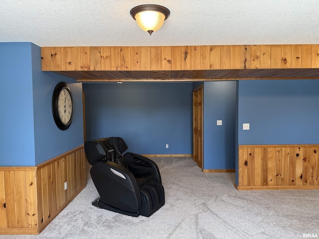 124 Riverview Heights Dr, Le Claire, IA 52753 - unfurnished room with carpet floors, a textured ceiling, wood walls, and wainscoting