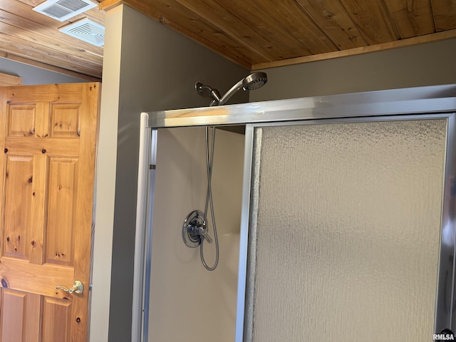 124 Riverview Heights Dr, Le Claire, IA 52753 - bathroom featuring a shower stall, wood ceiling, and vaulted ceiling