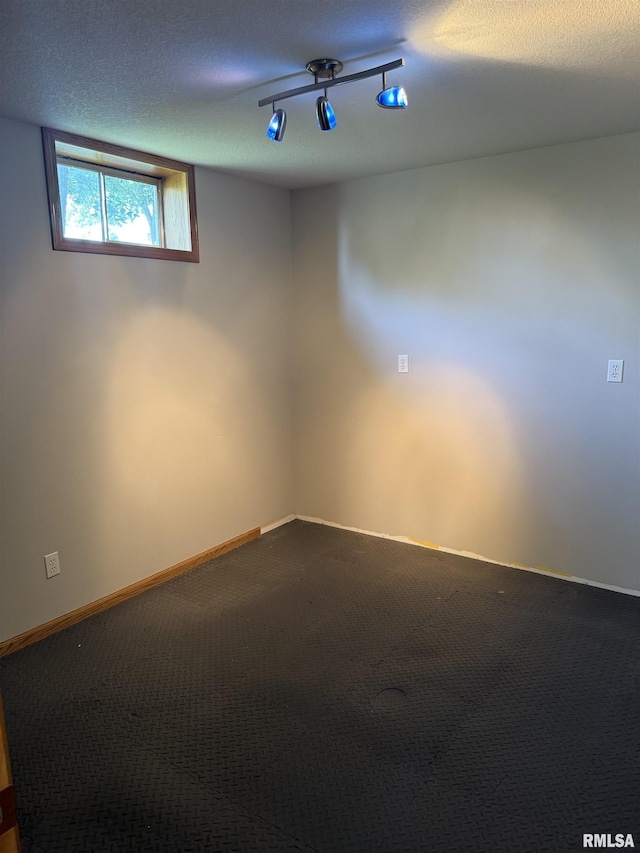 124 Riverview Heights Dr, Le Claire, IA 52753 - unfurnished room with dark carpet and baseboards