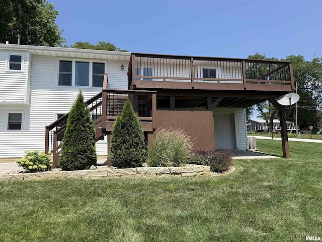 124 Riverview Heights Dr, Le Claire, IA 52753 - back of property featuring an attached garage, a wooden deck, a yard, and stairs