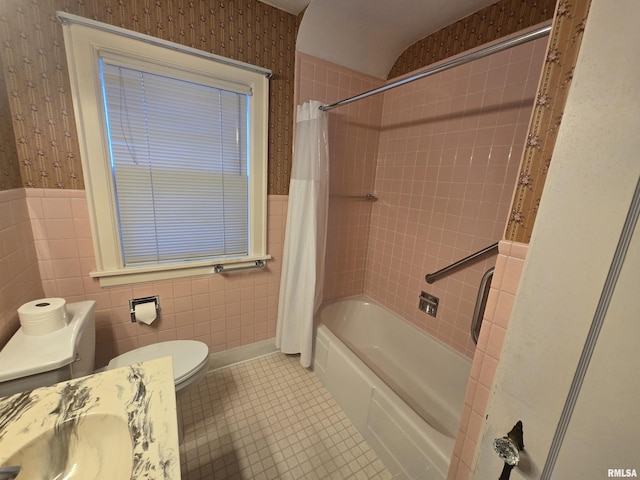 621 E 29th St, Davenport, IA 52803 - full bathroom featuring wallpapered walls, shower / bath combo with shower curtain, tile patterned flooring, wainscoting, and tile walls
