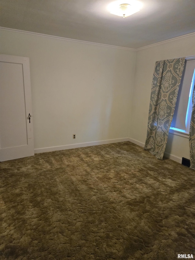621 E 29th St, Davenport, IA 52803 - spare room featuring crown molding and dark colored carpet