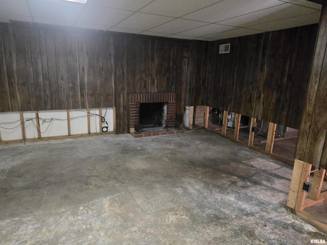 621 E 29th St, Davenport, IA 52803 - finished below grade area with wooden walls, a brick fireplace, and a paneled ceiling