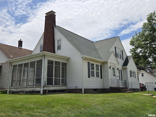 621 E 29th St, Davenport, IA 52803 - rear view of house featuring a shingled roof, a sunroom, a yard, and a chimney