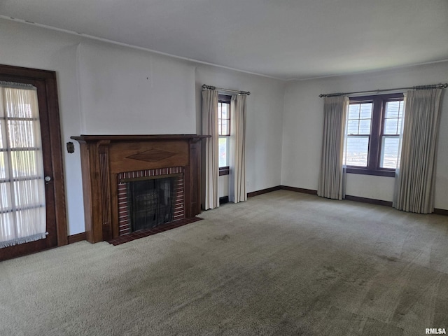 621 E 29th St, Davenport, IA 52803 - unfurnished living room featuring carpet flooring and a brick fireplace