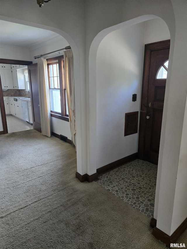 621 E 29th St, Davenport, IA 52803 - entrance foyer with carpet flooring and arched walkways