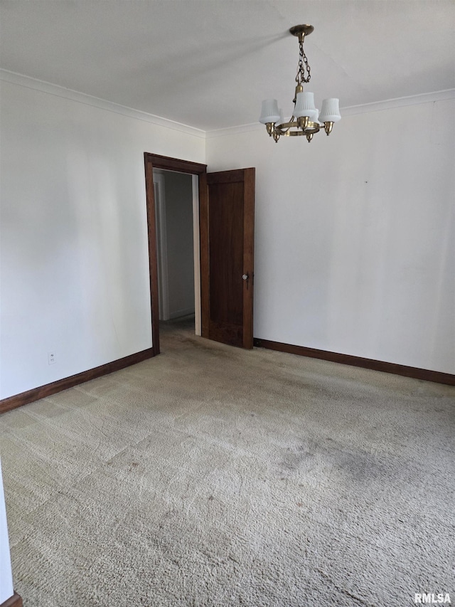 621 E 29th St, Davenport, IA 52803 - unfurnished room featuring ornamental molding, a chandelier, and carpet flooring