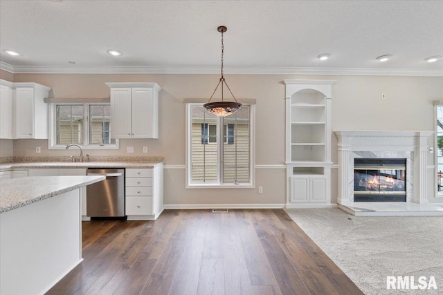1 S Shore Ln, Rapids City, IL 61278 - kitchen with dark wood-style flooring, white cabinets, stainless steel dishwasher, pendant lighting, and a fireplace