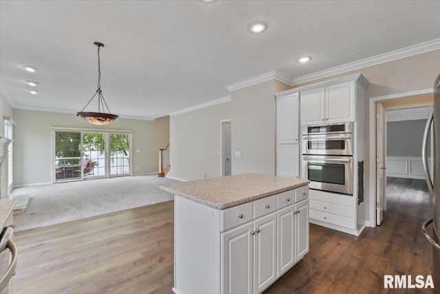 1 S Shore Ln, Rapids City, IL 61278 - kitchen with dark wood-style floors, open floor plan, light countertops, ornamental molding, and a kitchen island