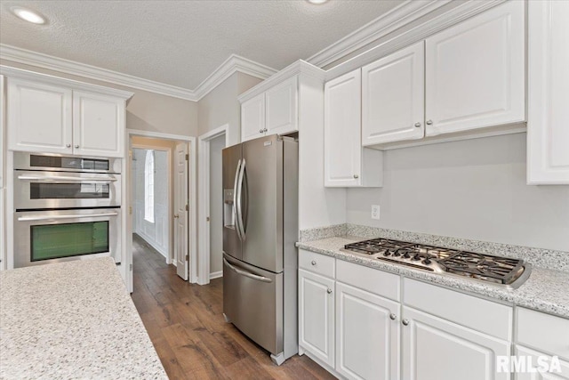 1 S Shore Ln, Rapids City, IL 61278 - kitchen with appliances with stainless steel finishes, white cabinets, light countertops, crown molding, and dark wood-style floors